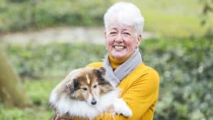 Senior woman having a dog
